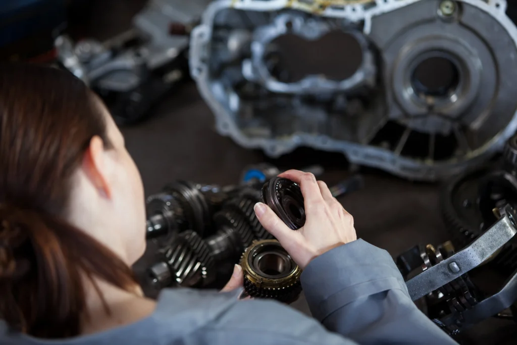 female-mechanic-fixing-gear
